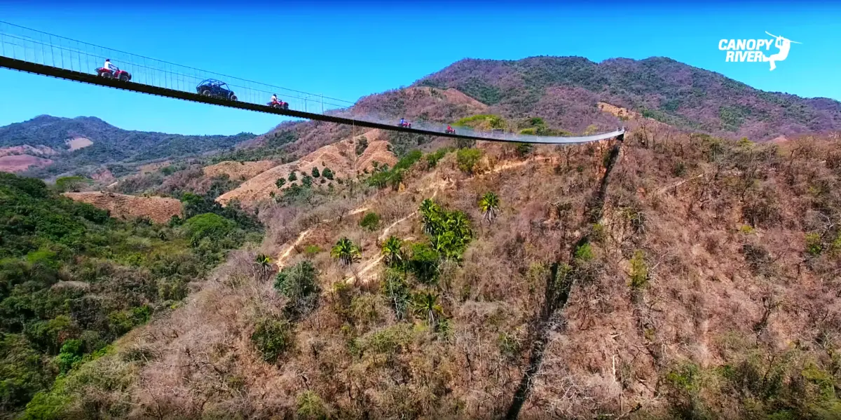 Jorullo bridge over the Cuale river and valley. ATVs crossing