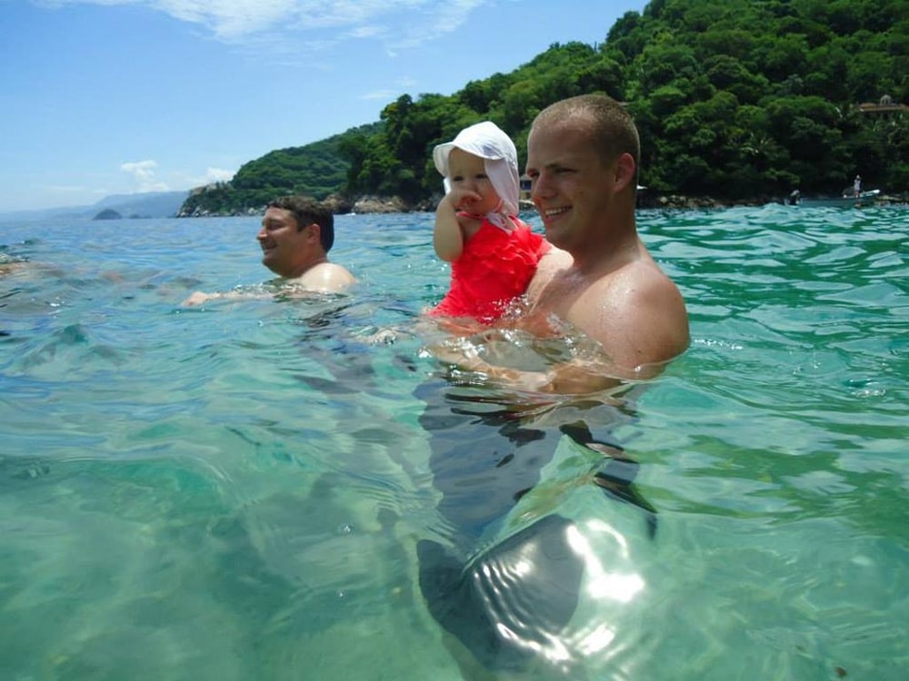 Puerto Vallarta beach during the summer vacation season with safety patrols and ocean conditions in view