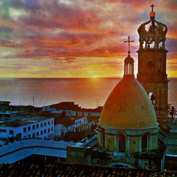 Our Lady of Guadalupe Parish crown and dome at sunset over Banderas Bay in Puerto Vallarta