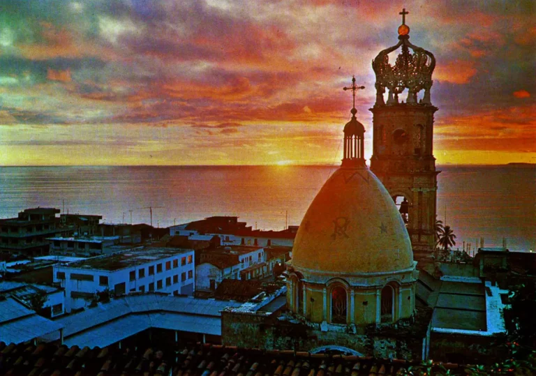 Our Lady of Guadalupe Parish crown and dome at sunset over Banderas Bay in Puerto Vallarta