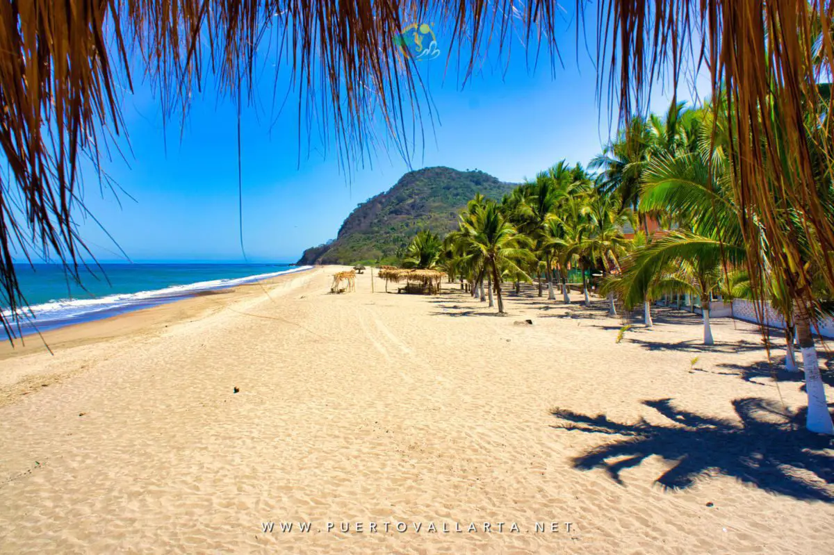 Lo de Marcos beach with a palapa and green headland