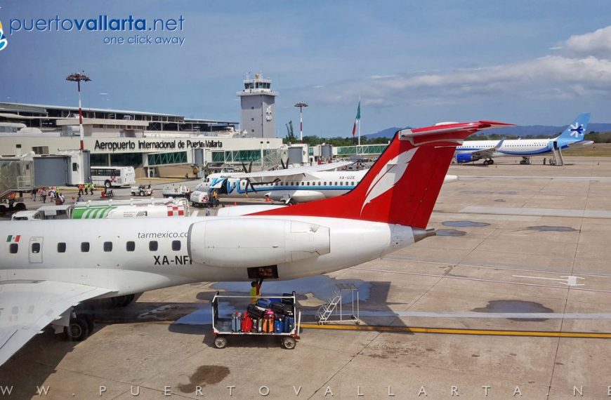 Southwest Airlines planes at Puerto Vallarta International Airport, with boarding gates and palm trees visible in the terminal