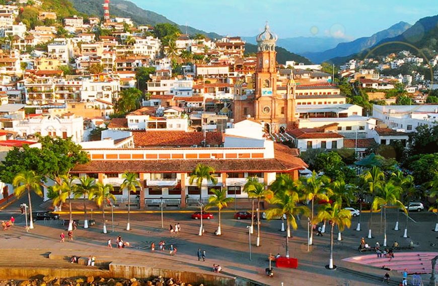 Puerto Vallarta downtown and Malecón with subtle golden award-themed light for the 2026 Travvy Awards nominations.
