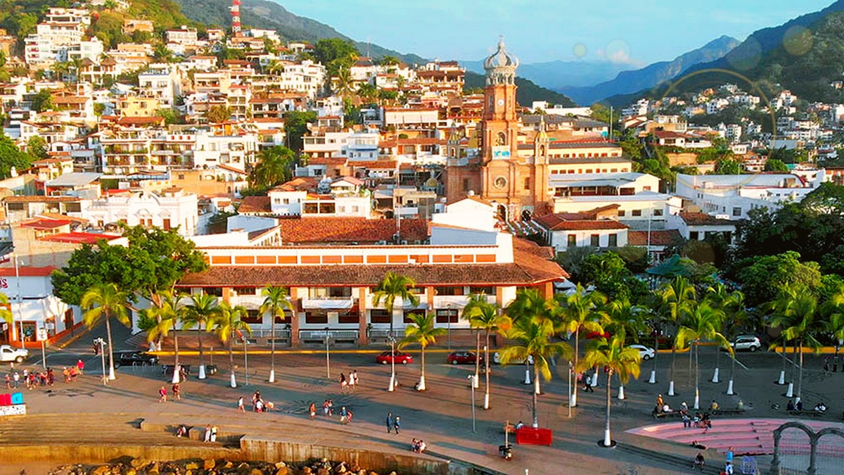 Puerto Vallarta downtown and Malecón with subtle golden award-themed light for the 2026 Travvy Awards nominations.