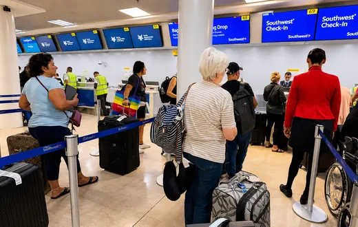 Airline check-in and bag drop counters at Puerto Vallarta airport before departure