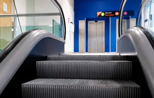 Escalator and elevator to the second-floor departures level at Puerto Vallarta airport