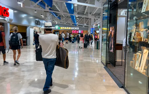 Shops and restaurants on the upper-level departure corridor at Puerto Vallarta airport