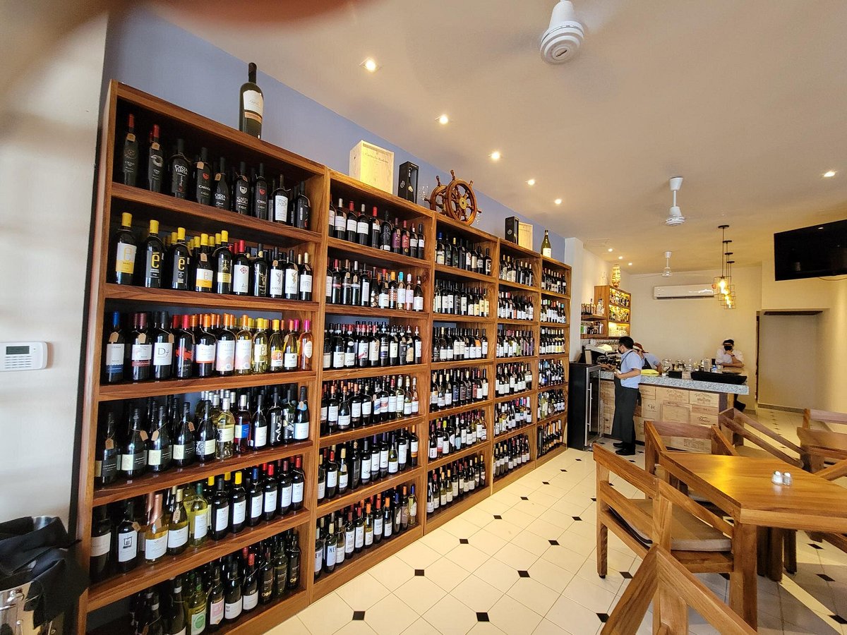 Wine bottle wall in Puerto Vallarta, used for restaurant wine awards coverage